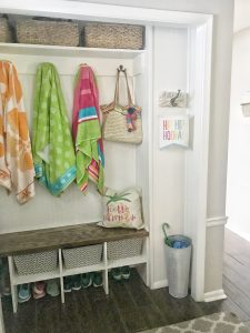 Organized summer towels in this former coat closet turned mud closet #smallspaces #organization #closets