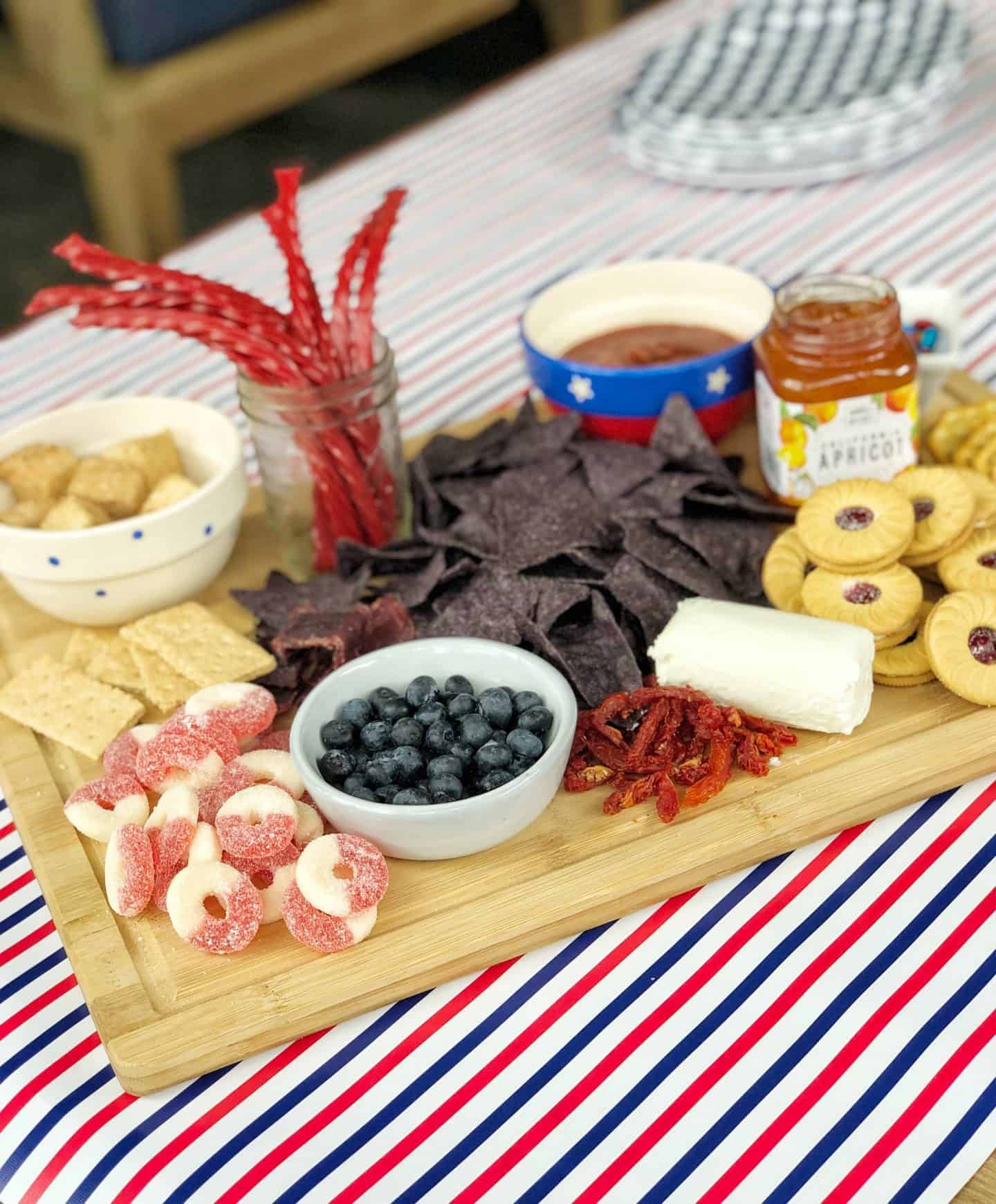 Red White and Blue themed snack platter for summer entertaining #charcuterieboard #snacktray #fingerfood #appetizers #4thofjuly