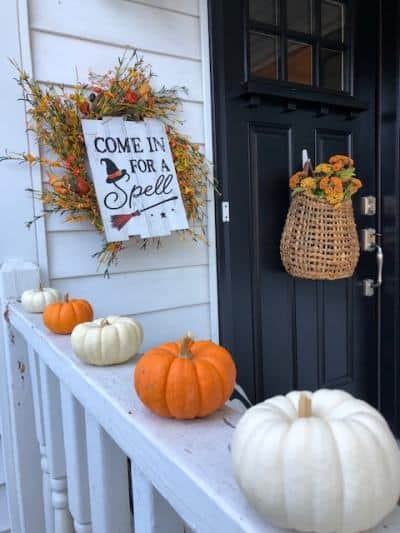 Mini pumpkins on front porch